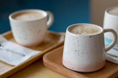 two cups of coffee sitting on a tray at Amika First203 AF23 in Tokyo