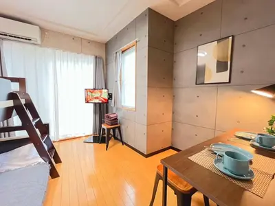 a room with a table and a dining room at Amika First203 AF23 in Tokyo