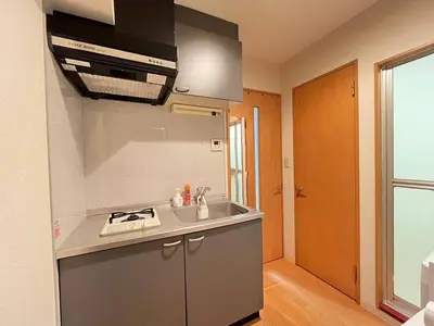 a small kitchen with a sink and a stove at Amika First102 AF12 in Tokyo