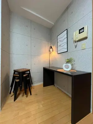 a room with a desk and a table and chairs at Amika First102 AF12 in Tokyo