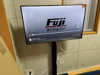 a flat screen tv on a stand in a room at Amika First102 AF12 in Tokyo