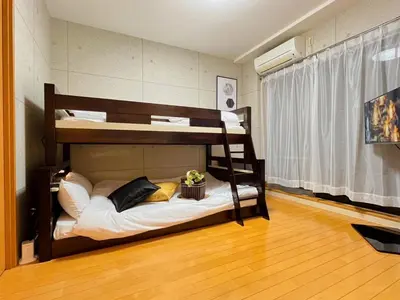 a room with two bunk beds in a room at Amika First102 AF12 in Tokyo