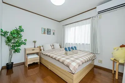 a bedroom with a bed and a window at Asakusa-Ginza-Skytree-Stn-4min-95sqm-Garage-2WC-2Swr in Tokyo