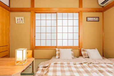 a bedroom with two beds and a window at Asakusa-Ginza-Skytree-Stn-4min-95sqm-Garage-2WC-2Swr in Tokyo