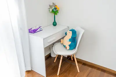 a teddy bear sitting on a chair next to a desk at Asakusa-Ginza-Skytree-Stn-4min-95sqm-Garage-2WC-2Swr in Tokyo