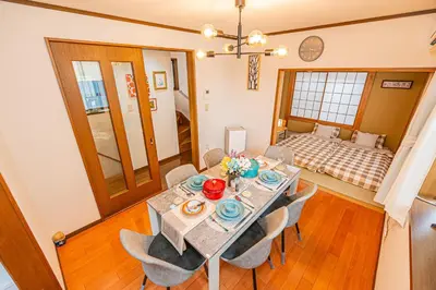 a dining room with a table and chairs at Asakusa-Ginza-Skytree-Stn-4min-95sqm-Garage-2WC-2Swr in Tokyo