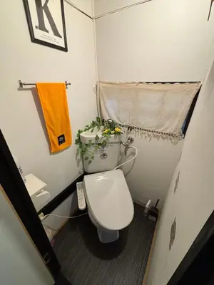 a small bathroom with a toilet and a sink at Yuki House in Tokyo