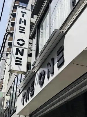 a sign for the entrance to a store on a building at the one ueno in Tokyo