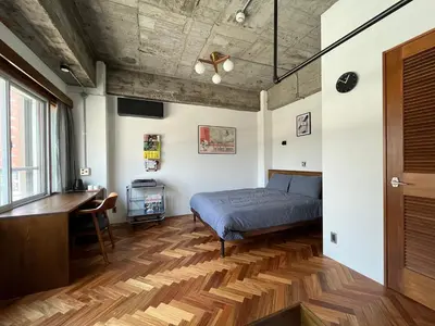 a bedroom with a bed and a desk at NO SERVICE HOTEL azumabashi in Tokyo