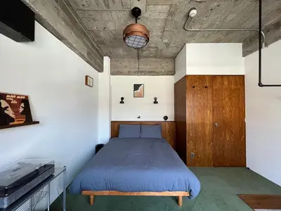 a bedroom with a bed in a room at NO SERVICE HOTEL azumabashi in Tokyo