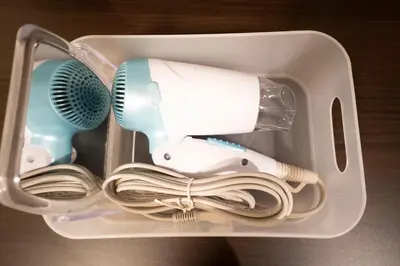 a plastic container with a hair dryer and a blow dryer at Jarudan in Tokyo