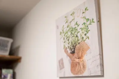 a picture of a flower vase on a wall at Jarudan in Tokyo
