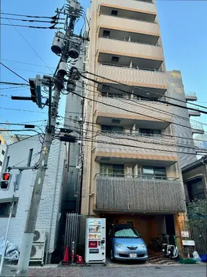 a car parked in front of a tall building at Love Asakusa Downtown 2bedroom Asakusa Kuramae train 3mins in Tokyo