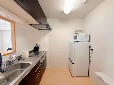 a kitchen with a white refrigerator and a sink at Love Asakusa Downtown 2bedroom Asakusa Kuramae train 3mins in Tokyo