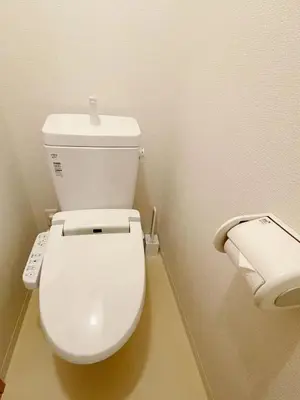 a white toilet in a bathroom with a roll of toilet paper at Love Asakusa Downtown 2bedroom Asakusa Kuramae train 3mins in Tokyo
