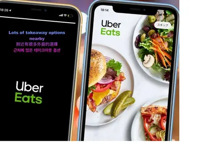 two iphone screens showing the uber eats app next to plates of food at Love Asakusa Downtown 2bedroom Asakusa Kuramae train 3mins in Tokyo