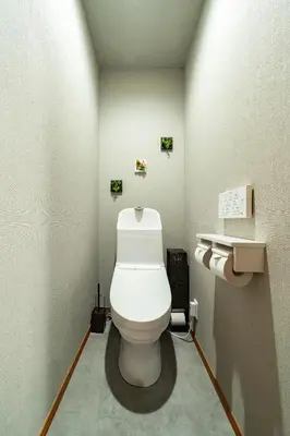 a bathroom with a white toilet in a room at 74, Yotsugi, Entire house for rent, \u56db\u3064\u6728 in Tokyo
