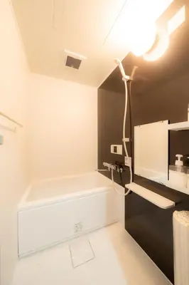 a bathroom with a tub and a light on the ceiling at 20, Hikifune, Entire house for rent, \u66f3\u821f in Tokyo