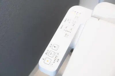 a white wii remote control sitting on a table at 20, Hikifune, Entire house for rent, \u66f3\u821f in Tokyo
