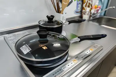 a frying pan sitting on top of a stove at 38, Kyojima 3, Entire house for rent, \u4eac\u5cf63\u4e01\u76ee in Tokyo