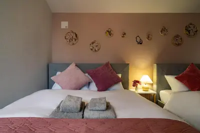 a bedroom with a bed with two towels on it at 83, Higashi-Yotsugi 3, Entire house for rent in Tokyo