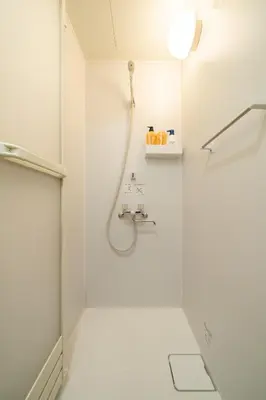a white bathroom with a shower and a sink at 96, Tateishi A, Entire house for rent, \u7acb\u77f3A in Tokyo