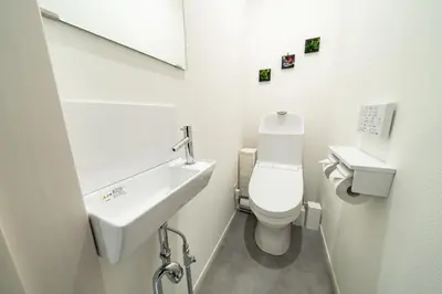 a white bathroom with a sink and a toilet at 96, Tateishi A, Entire house for rent, \u7acb\u77f3A in Tokyo