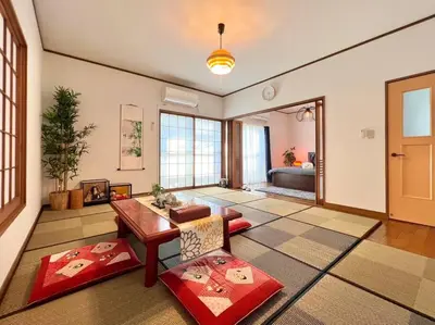 a living room with a table and a couch at FUKU House in Tokyo