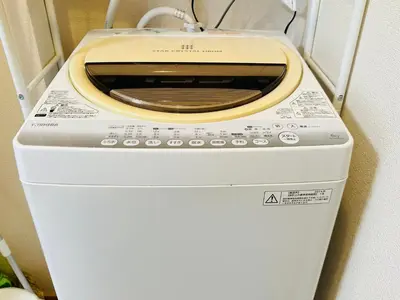 a washer and dryer in a room at \u30b7\u30e3\u30f3\u30c6\u9ad8\u7530\u99ac\u583432 in Tokyo