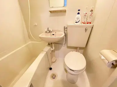 a small bathroom with a toilet and a sink at \u30b7\u30e3\u30f3\u30c6\u9ad8\u7530\u99ac\u583432 in Tokyo