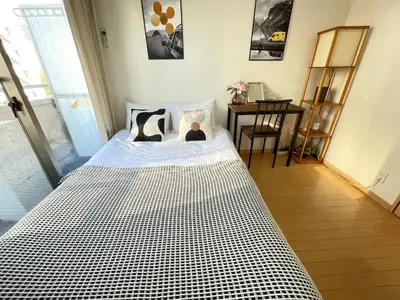 a bedroom with a bed with a teddy bear on it at \u30b7\u30e3\u30f3\u30c6\u9ad8\u7530\u99ac\u583441 in Tokyo
