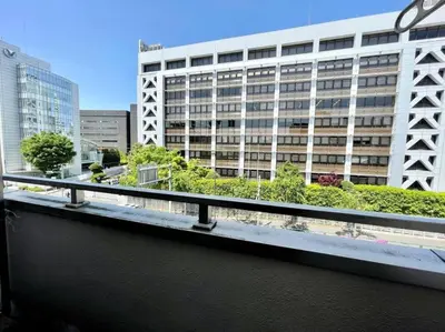 a view of a large building from a balcony at \u30b7\u30e3\u30f3\u30c6\u9ad8\u7530\u99ac\u583442 in Tokyo