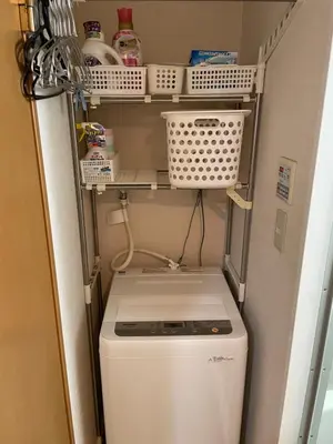 a washer and dryer in a kitchen with shelves at \u6771\u4eac\u306e\u6e2f\u7063-Tokyo Harbor -28 square meter king size garden room103 in Tokyo