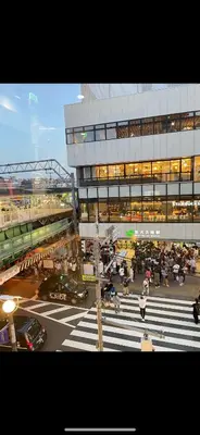 a busy city intersection with a building and a crosswalk at \u6771\u4eac\u306e\u6e2f\u7063-Tokyo Harbor -28 square meter king size garden room103 in Tokyo