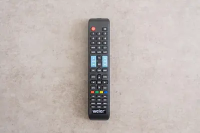 a remote control sitting on top of a table at K-room in Tokyo
