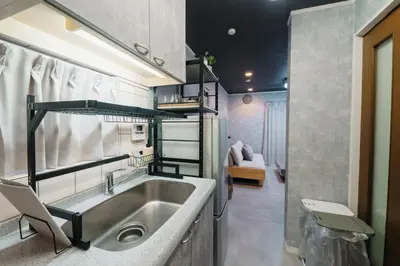 a kitchen with a stainless steel sink in a room at Pet-Friendly, Projector, 2LDK, 6pp, Shinagawa Area in Tokyo