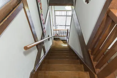 a staircase in a house with wooden beams at Samurai House - Vacation STAY 54179v in Tokyo