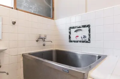 a large stainless steel tub in a bathroom at Samurai House - Vacation STAY 54179v in Tokyo