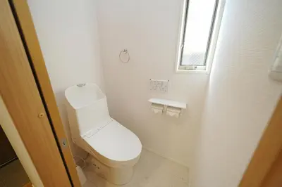 a bathroom with a toilet and a window at Jacky's House Yahiro in Tokyo