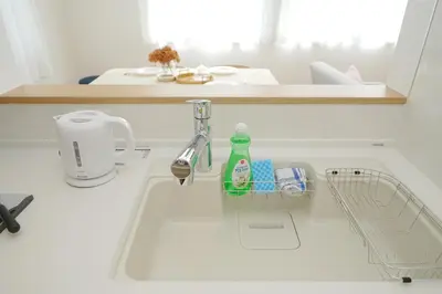 a kitchen counter with a sink and a sink at Jacky's House Yahiro in Tokyo