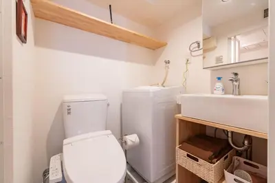 a small bathroom with a toilet and a sink at AsahiStay -Asakusa, Self check in & Well located house in Tokyo