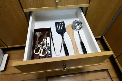 a drawer with utensils in a wooden box at Largo in Tokyo