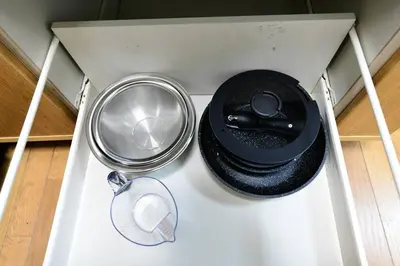 a white drawer with some food items in it at Largo in Tokyo