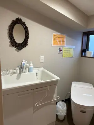 a bathroom with a sink and a toilet at \u5343\u99c4\u6728\u306e\u52c7 in Tokyo