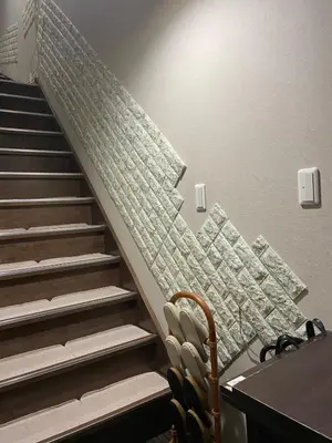 a staircase in a room with a table and chairs at \u5343\u99c4\u6728\u306e\u52c7 in Tokyo