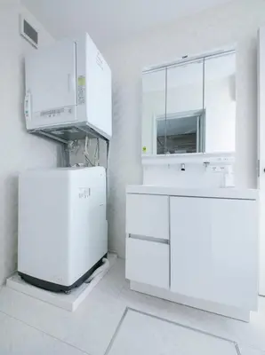a white kitchen with a sink and a refrigerator at pufuka Higashi Mukojima 4 in Tokyo