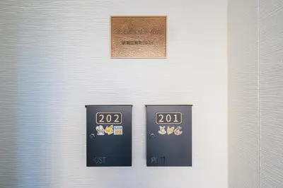 two black machines sitting next to each other on a wall at Room 201 - Itabashi Minamicho - Diamond Yu in Tokyo