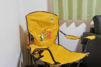 a yellow chair sitting next to a wall at Room 201 - Itabashi Minamicho - Diamond Yu in Tokyo