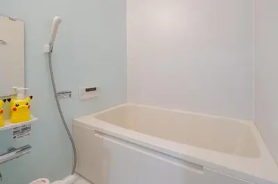 a bathroom with a bath tub and a sink at Room 201 - Itabashi Minamicho - Diamond Yu in Tokyo