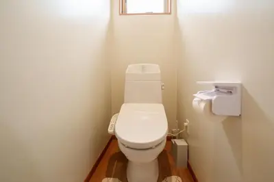 a white toilet in a bathroom with a window at Room 202 - Itabashi Minamicho - Diamond Yu in Tokyo